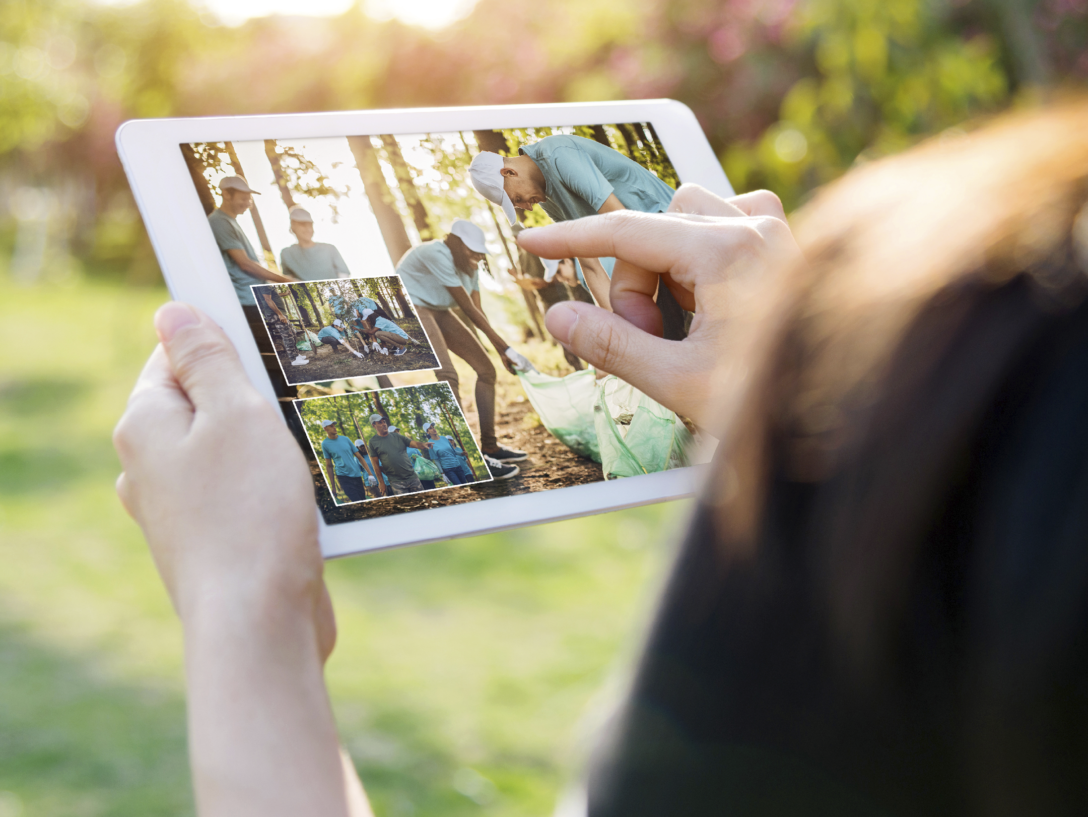 Woman hand using a digital tablet outdoors 